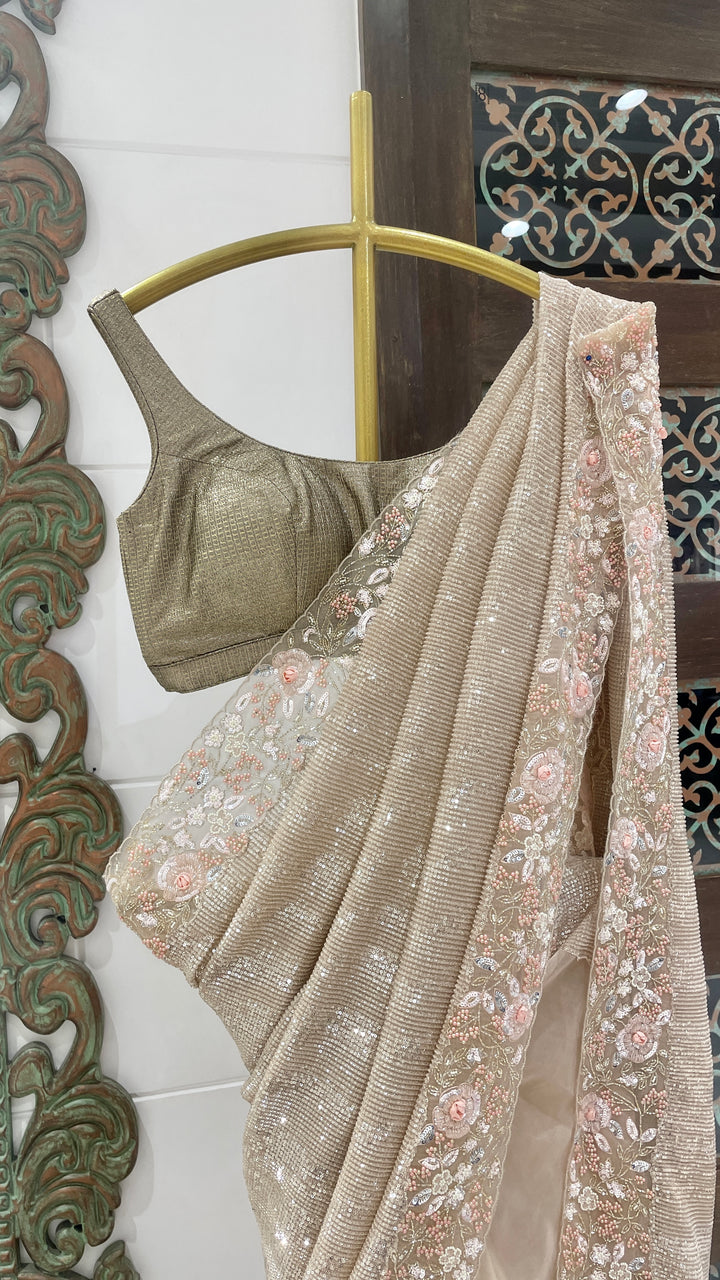 Gold sequins saree with floral embellishments