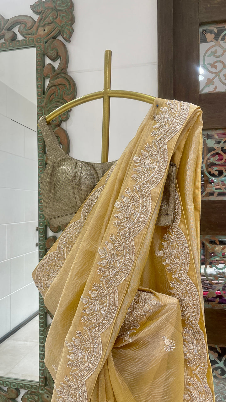 Gold tissue saree with embellishments