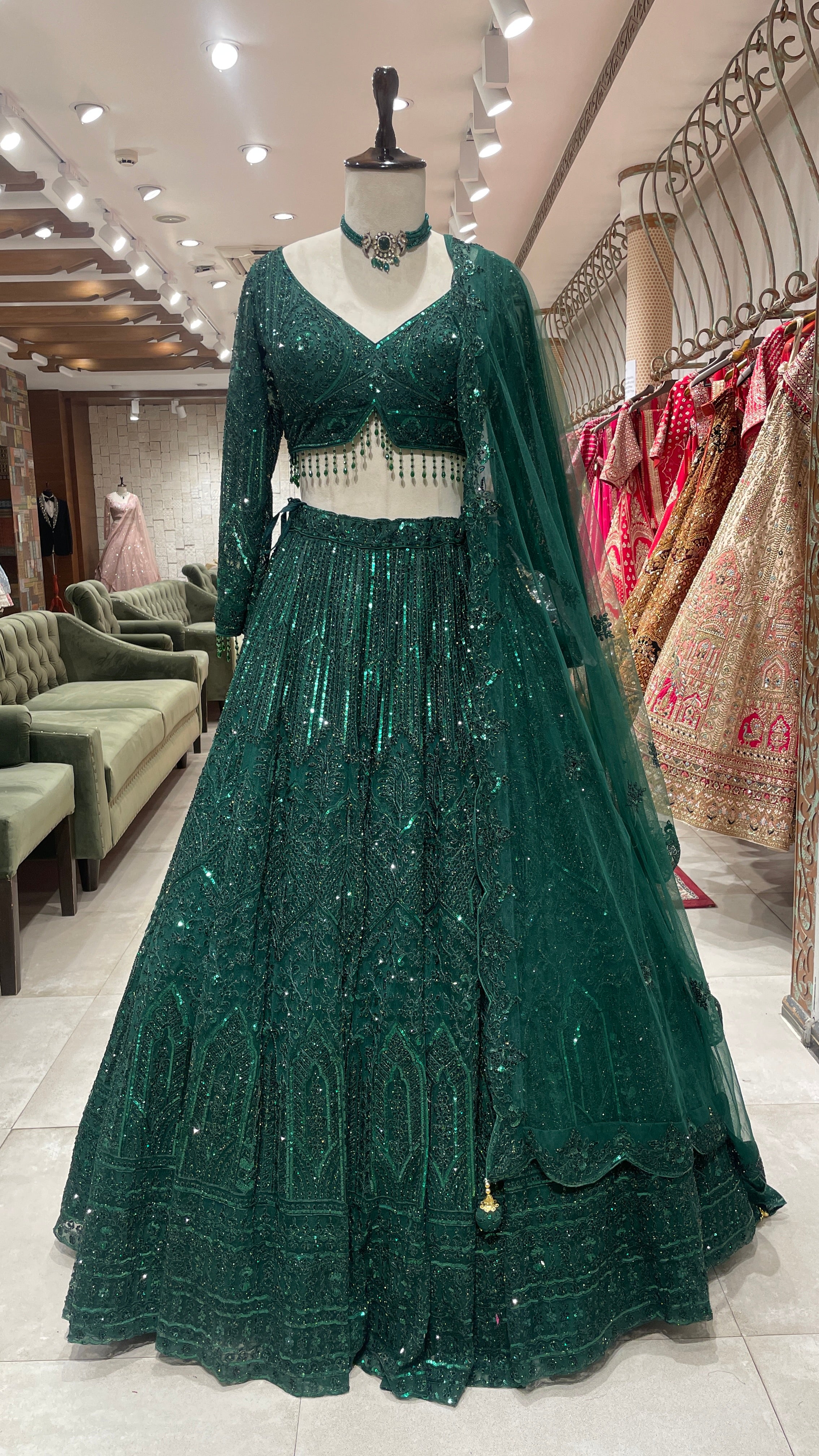 Emerald green net lehenga with sequins