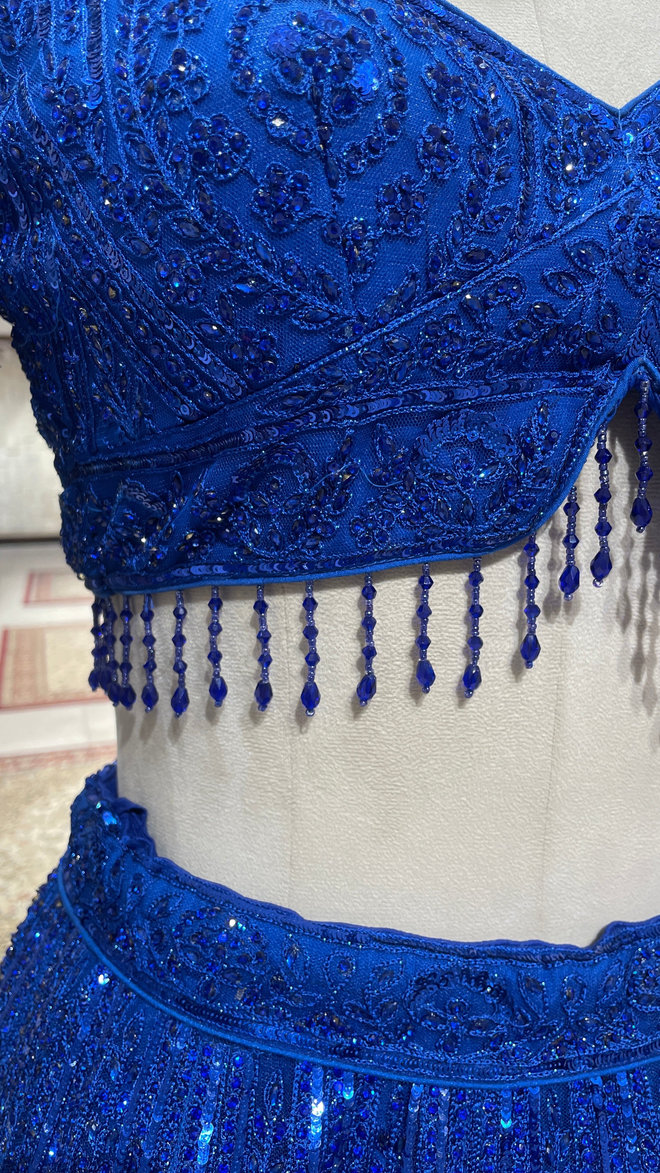 Royal blue net lehenga with threadwork and sequin embellishments