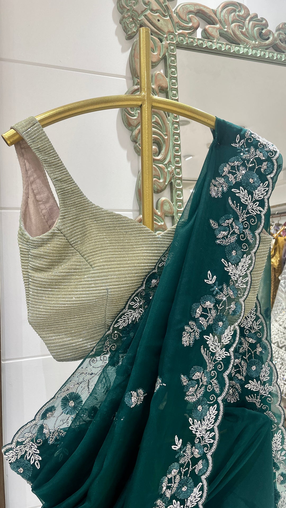 Green organza saree with sequins embellishments