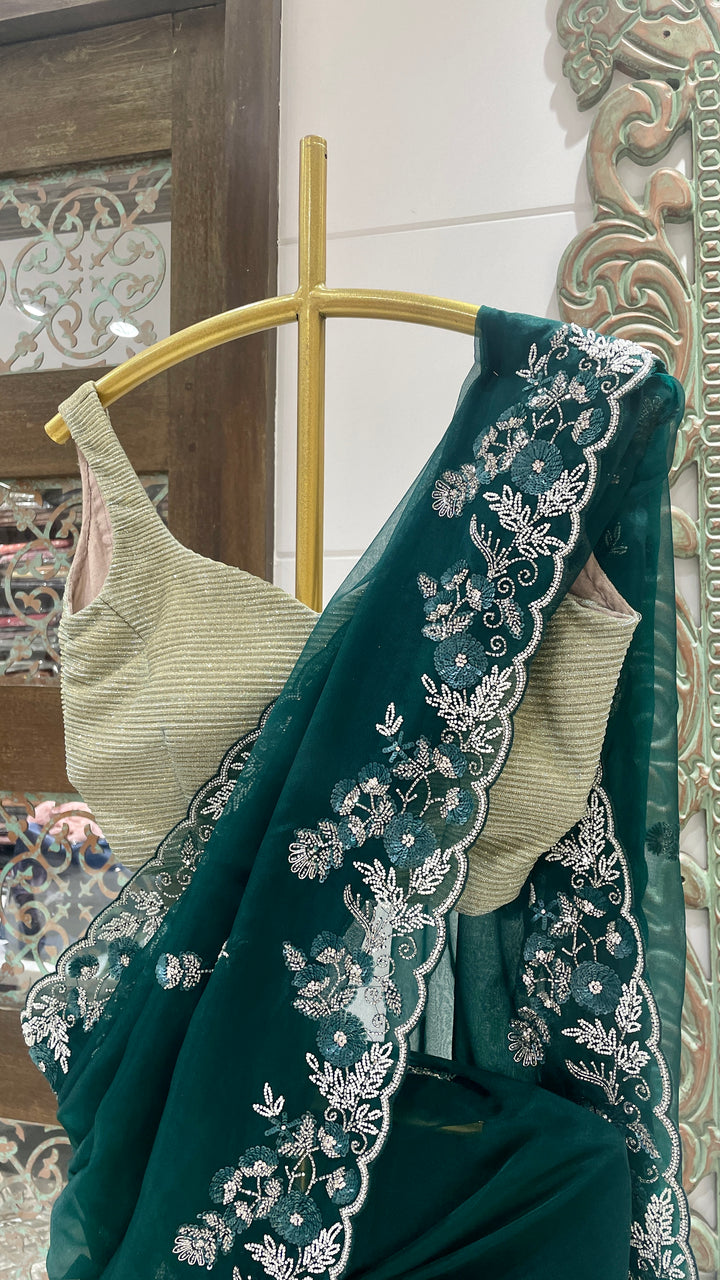 Green organza saree with sequins embellishments