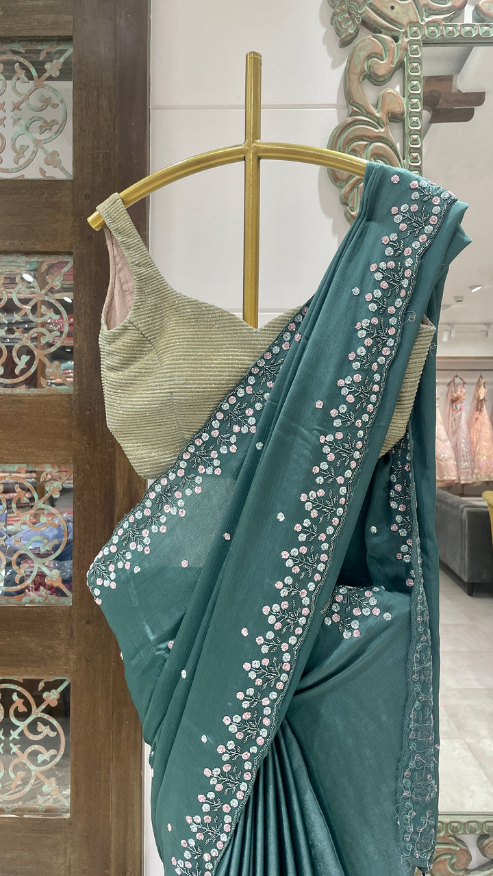Green crepe saree with floral motifs