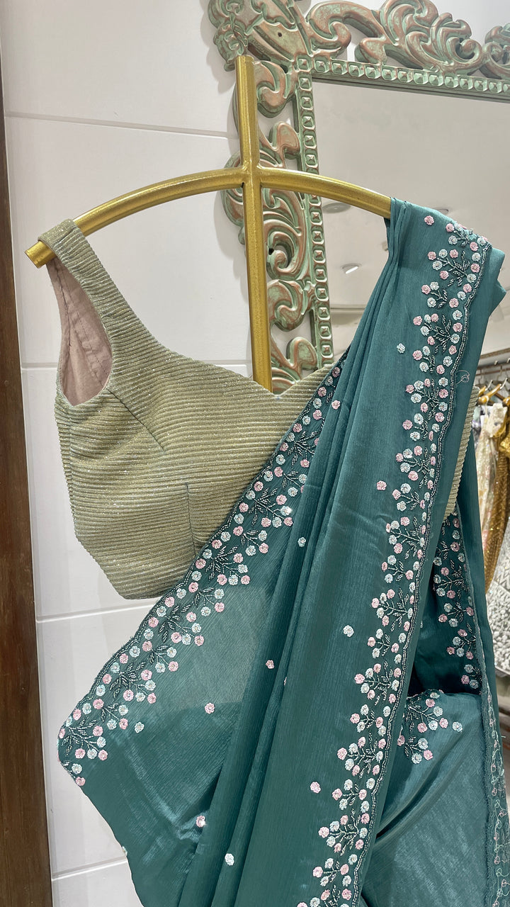 Green crepe saree with floral motifs