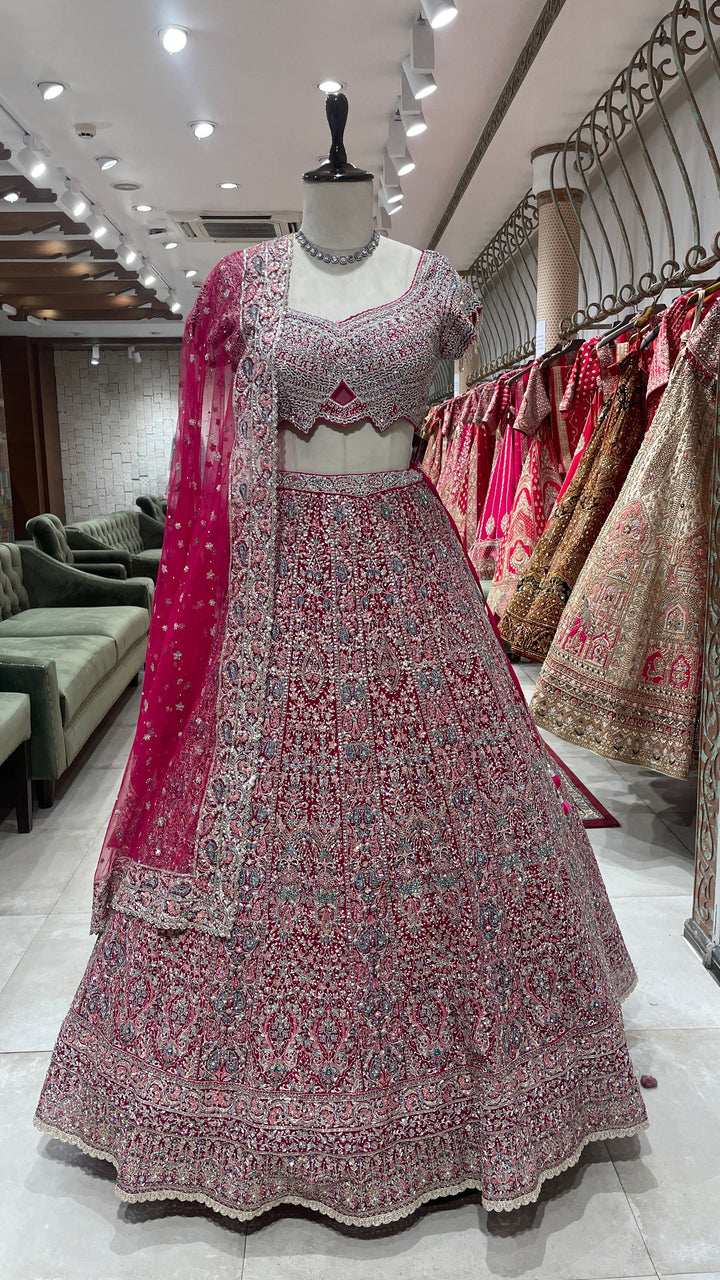 Pink net lehenga with floral motifs