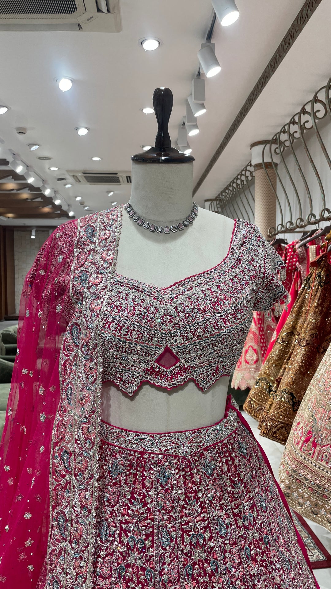 Pink net lehenga with floral motifs