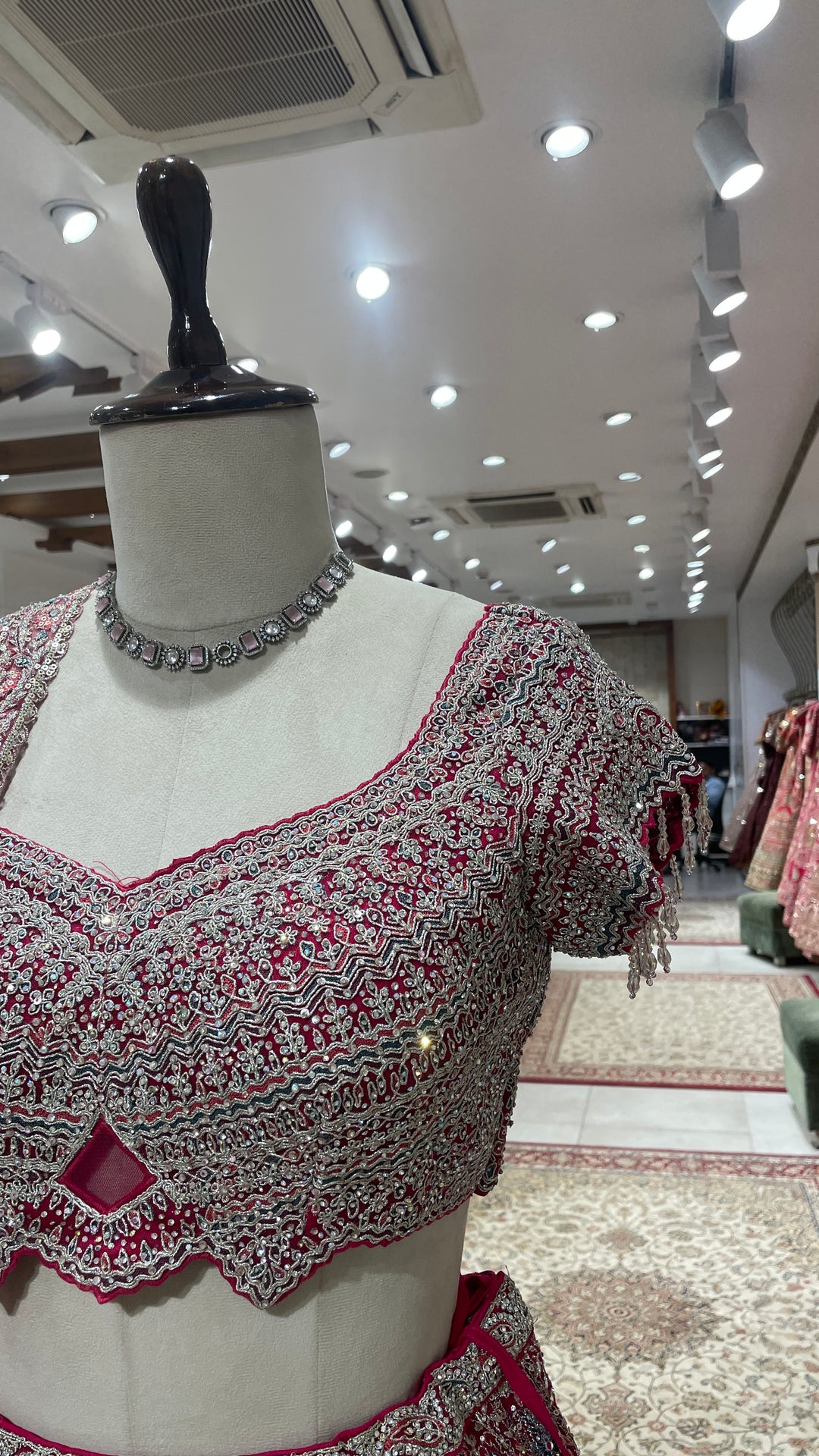 Pink net lehenga with floral motifs