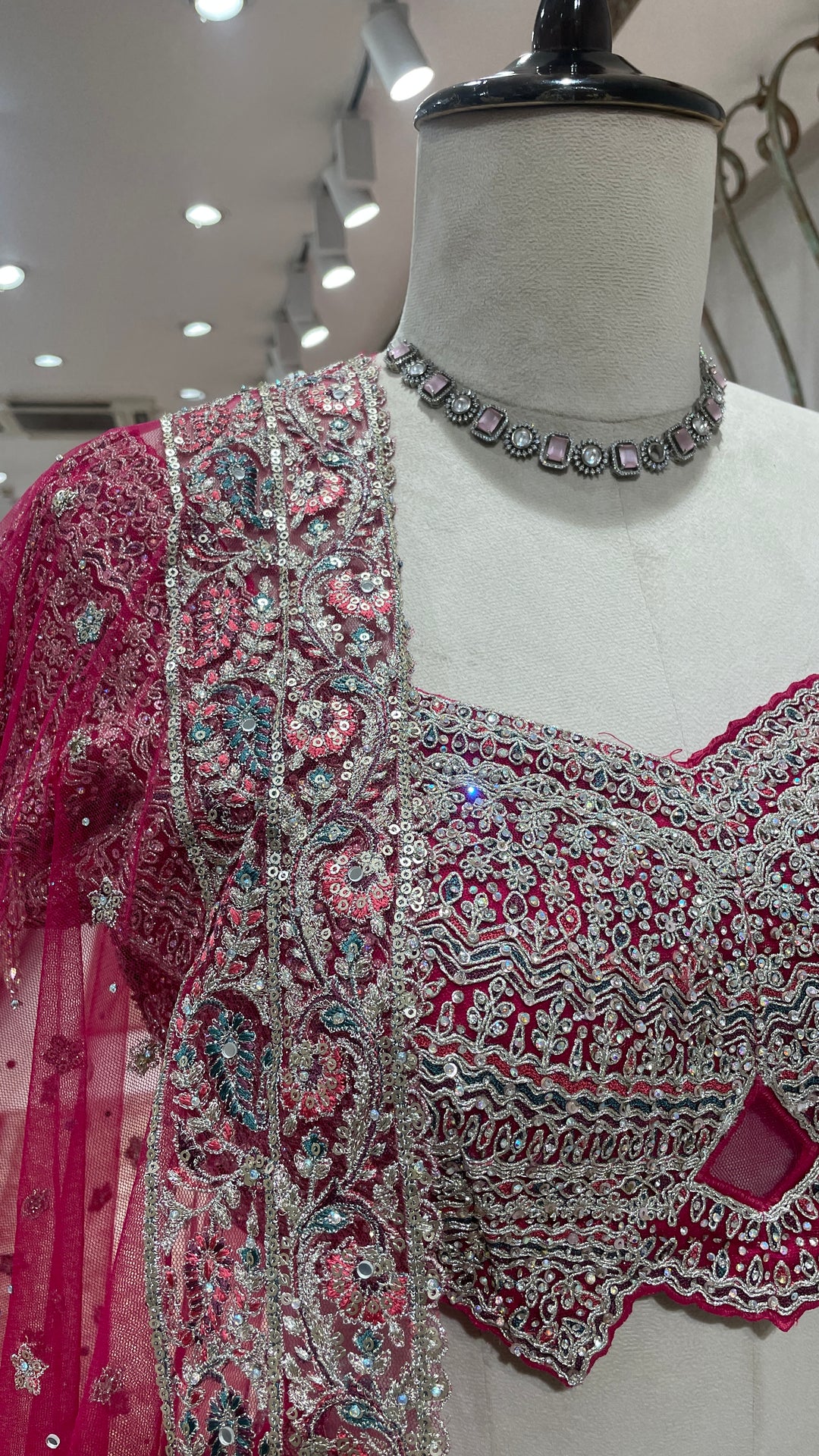 Pink net lehenga with floral motifs