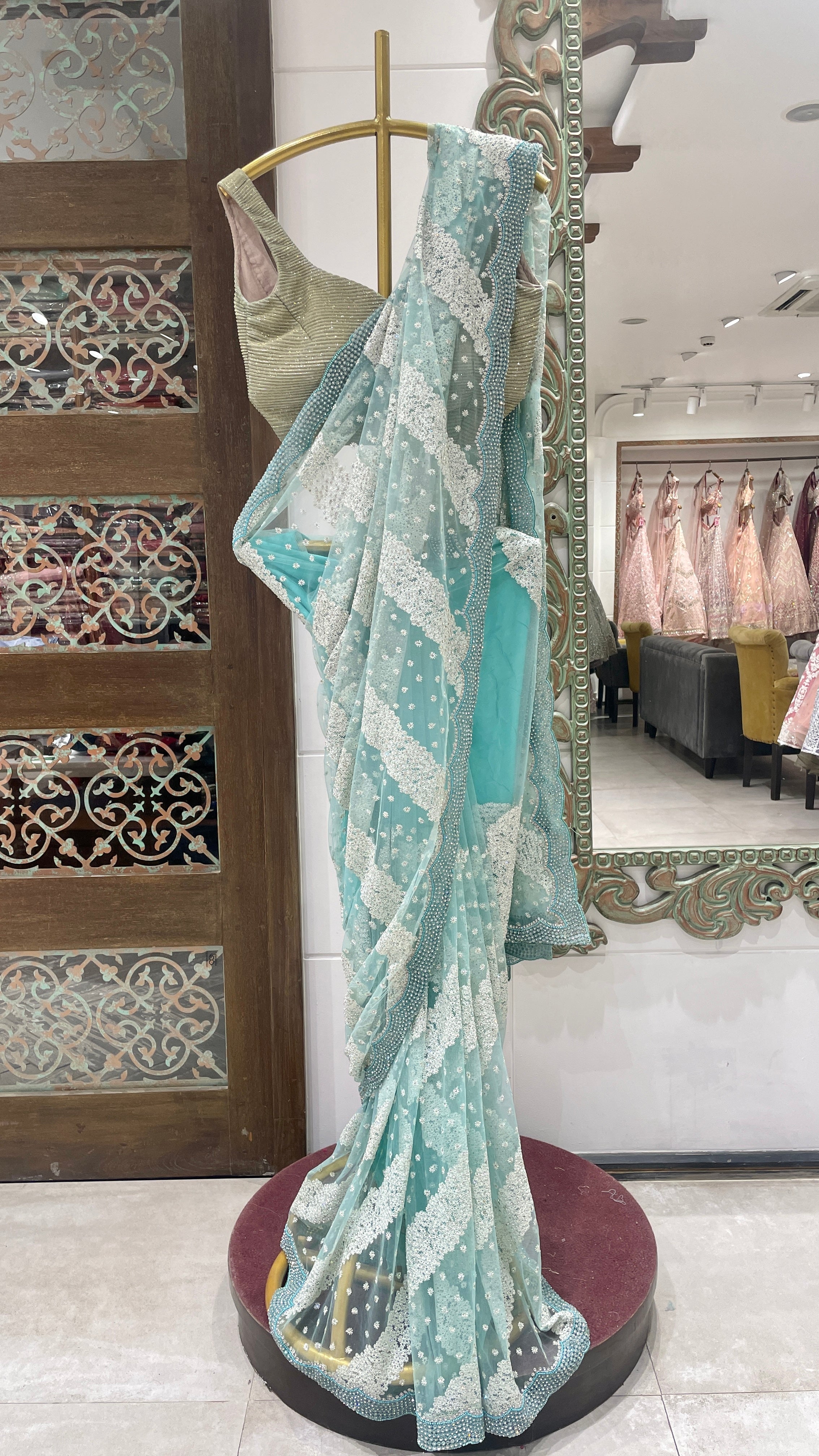 Blue net saree with floral motifs