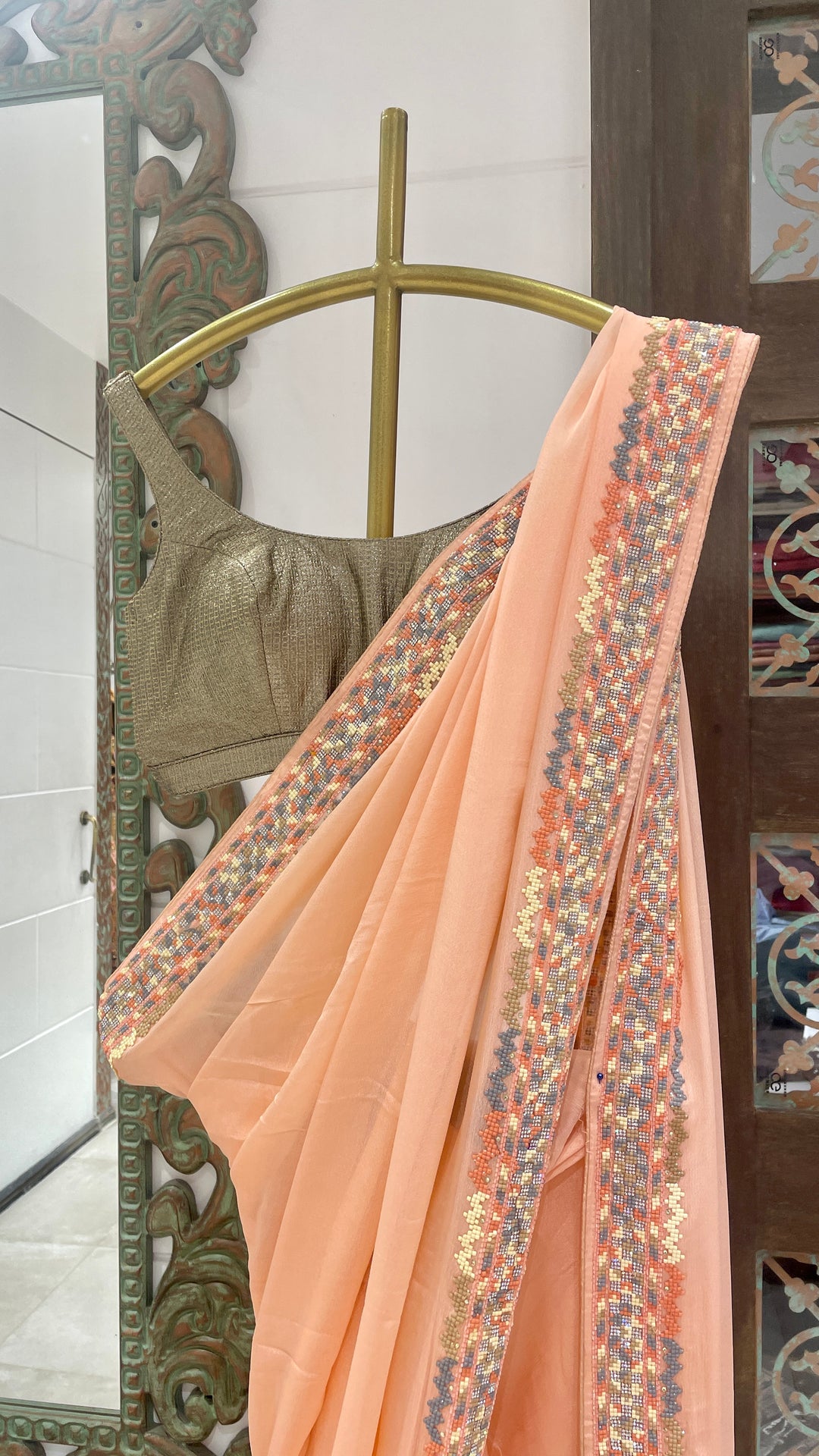 Peach crepe saree with embellishments