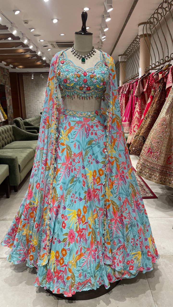 Sky blue cape style lehenga with floral prints