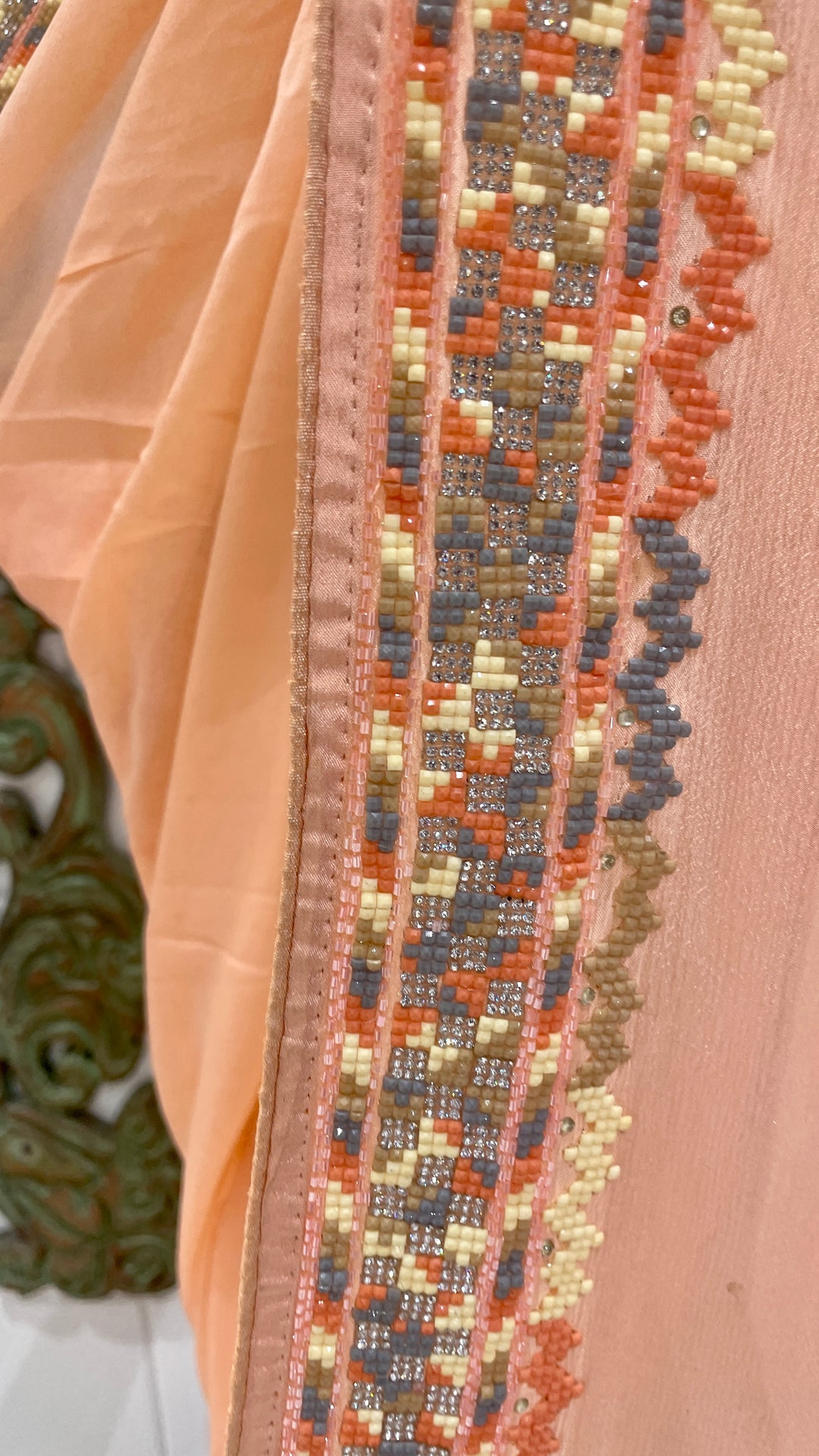 Peach crepe saree with embellishments
