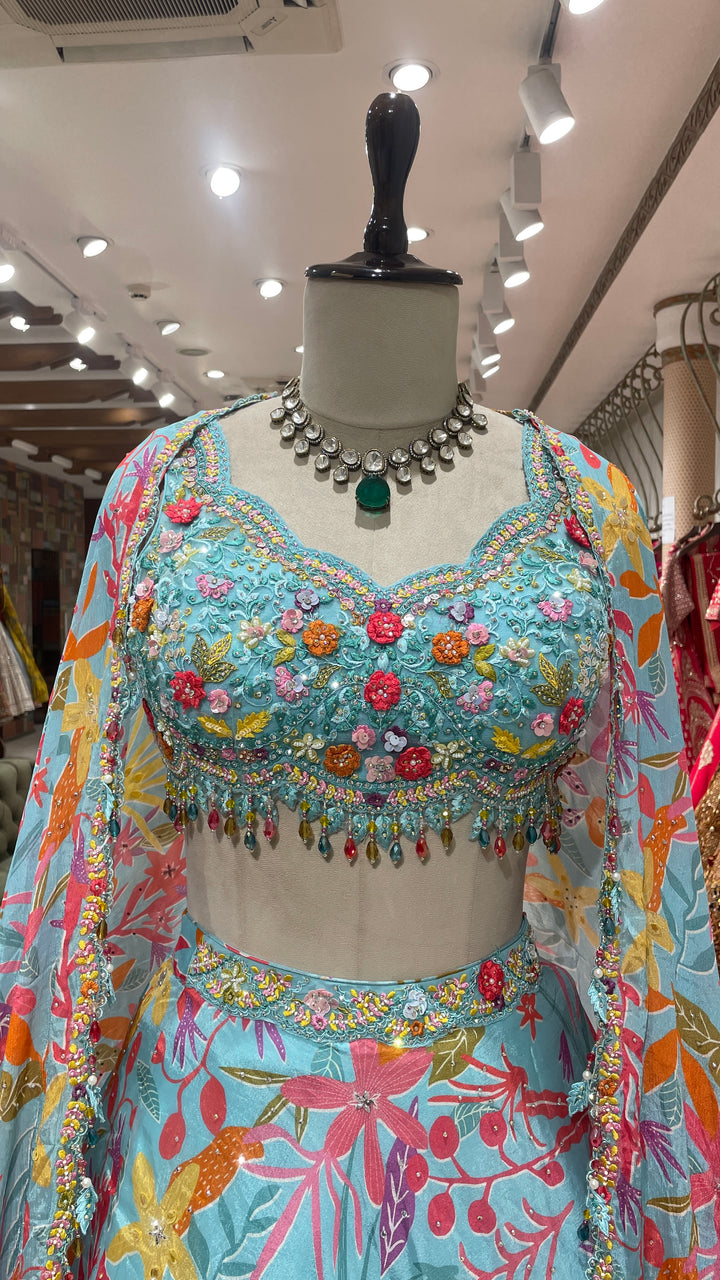 Sky blue cape style lehenga with floral prints