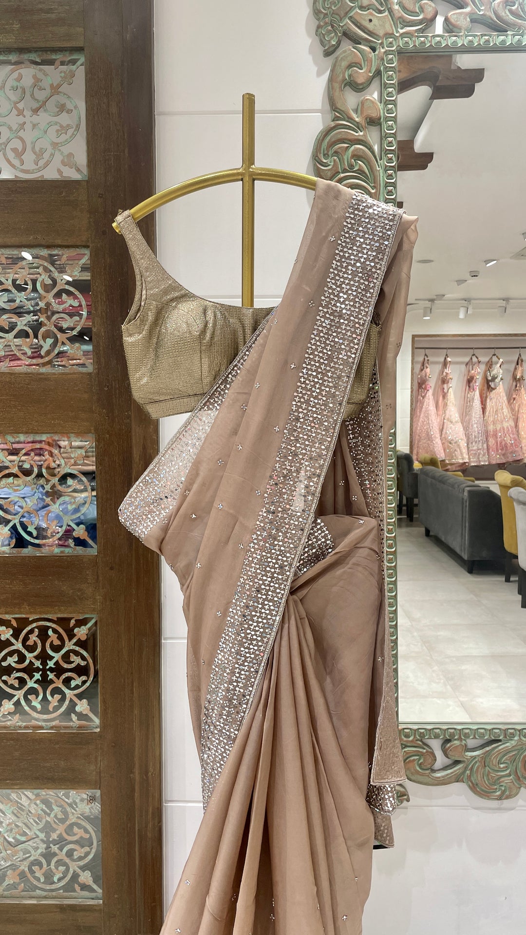 Brown organza saree with mirrorwork