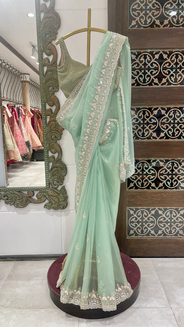 Green organza saree with cutdana embellishments