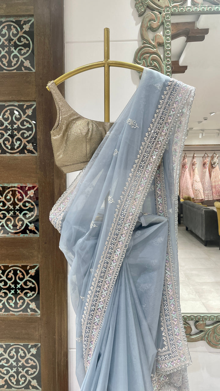 Blue organza saree with sequins and cutdana
