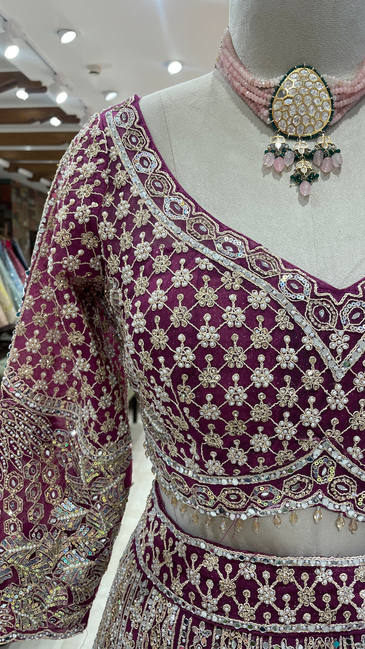 Wine colour lehenga with gold and silver sequence work