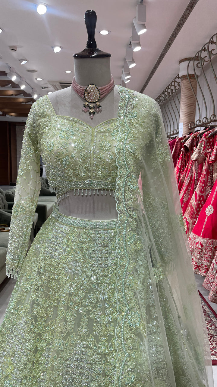 Pista Green colour Lehenga with sequins and pearlwork