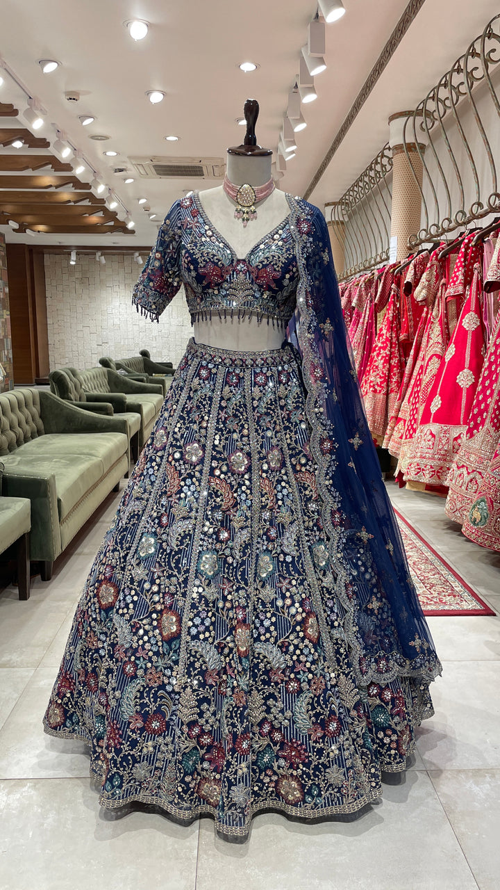 Navy blue colour lehenga with multicolour thread and sequins work