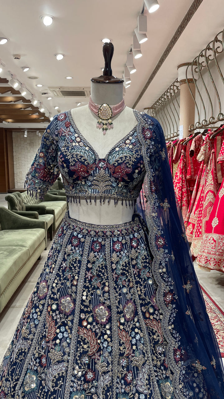 Navy blue colour lehenga with multicolour thread and sequins work