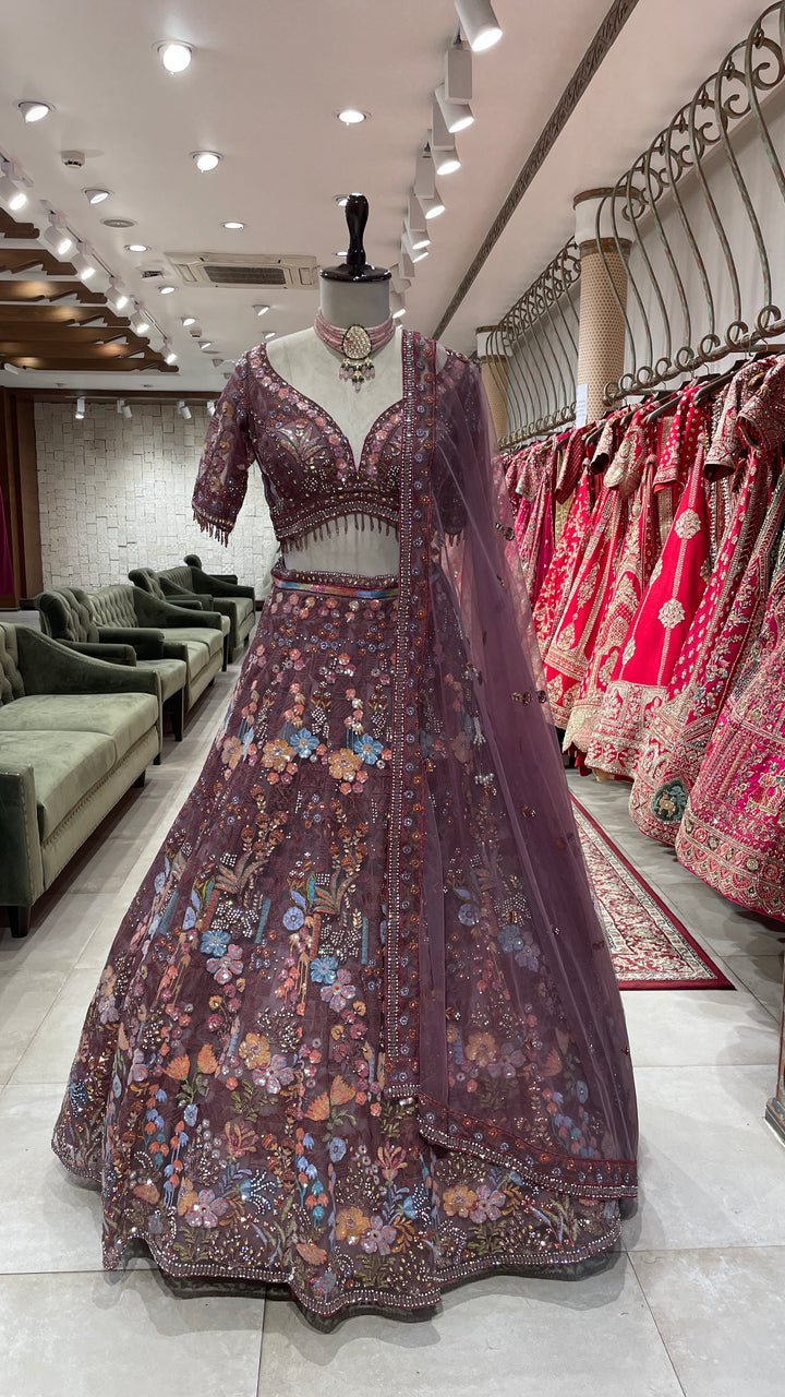 Rust colour Lehenga with multicolour thread and sequins work