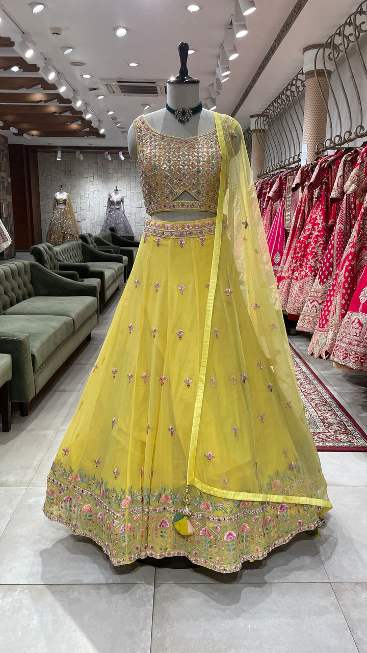 Yellow Georgette lehenga with floral motifs