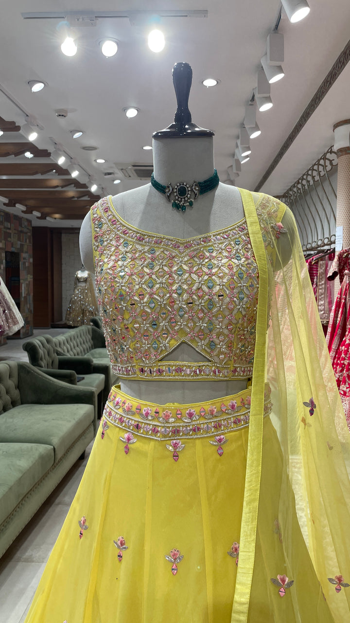 Yellow Georgette lehenga with floral motifs