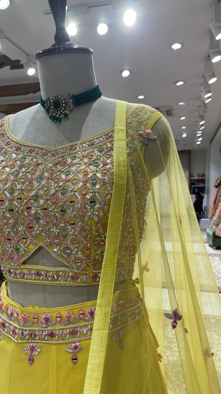 Yellow Georgette lehenga with floral motifs