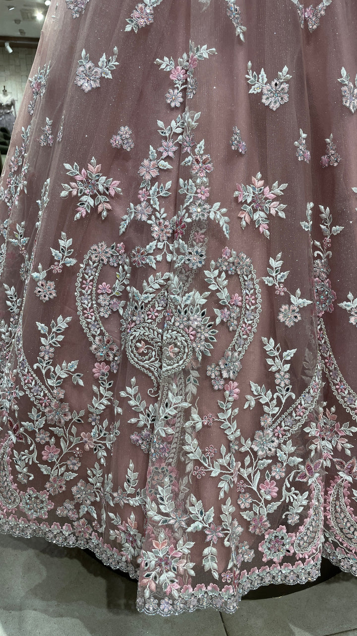 Pink net lehenga with mirrorwork and floral motifs