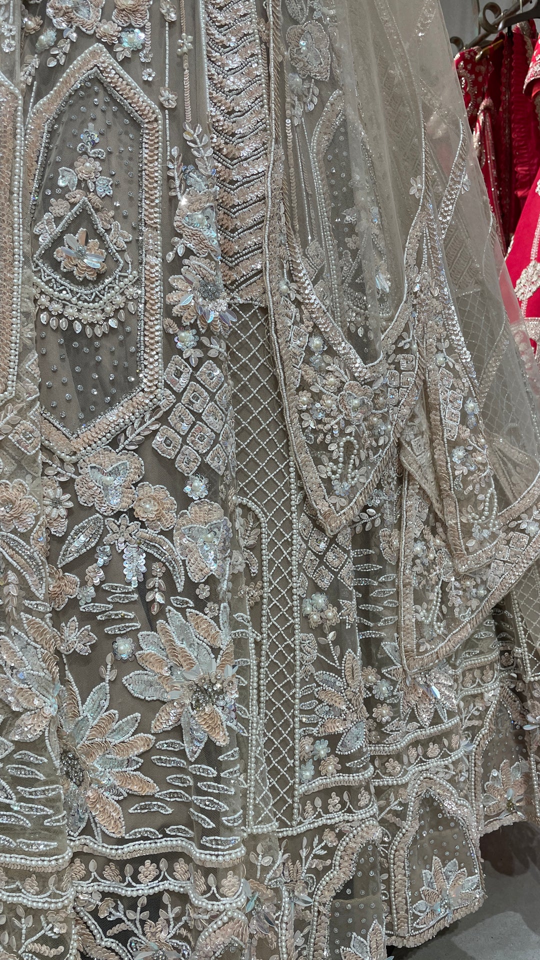 Cream net lehenga with sequins and cutdana embellishments