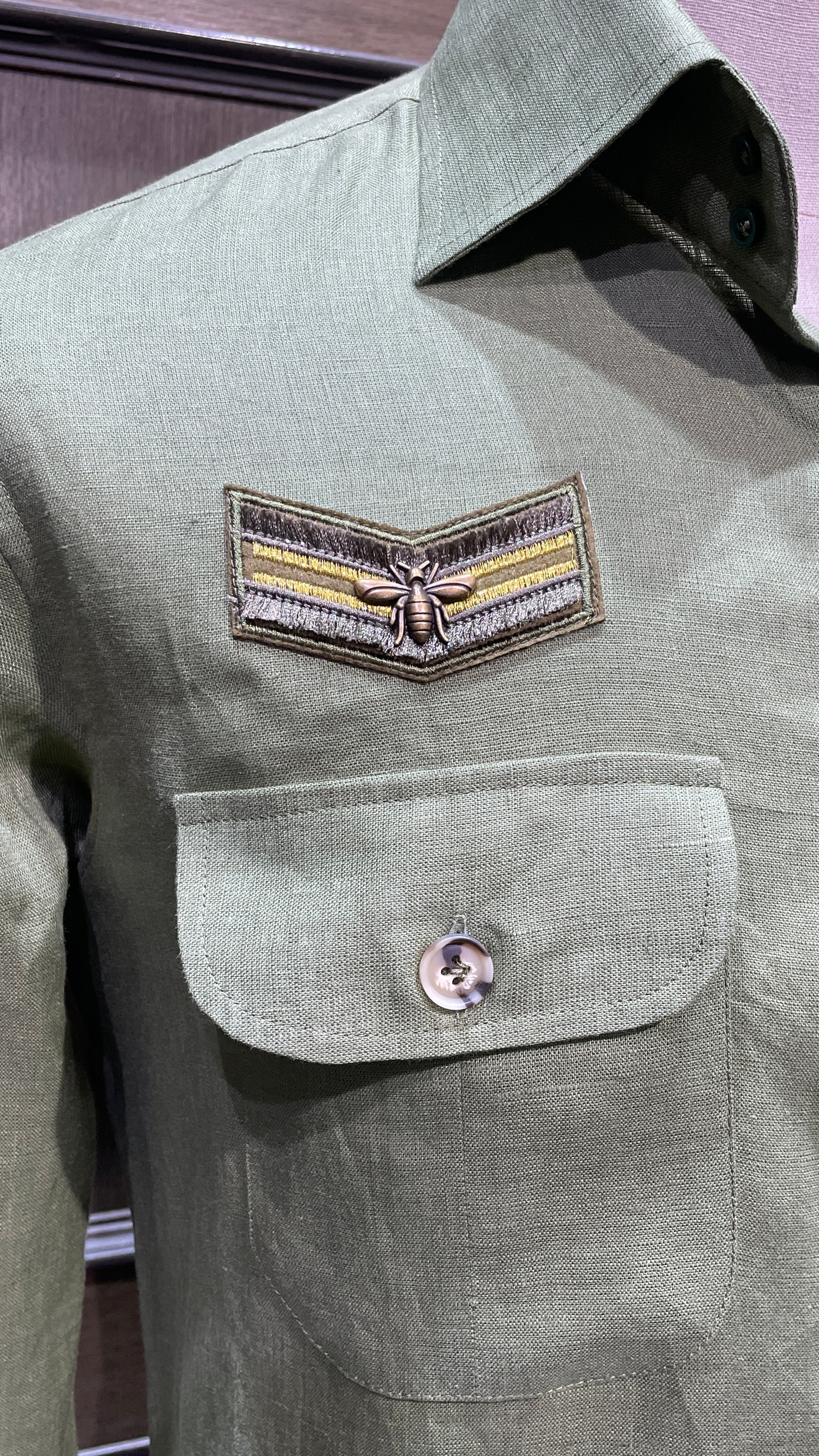 Green linen safari shirt with embroidered badges
