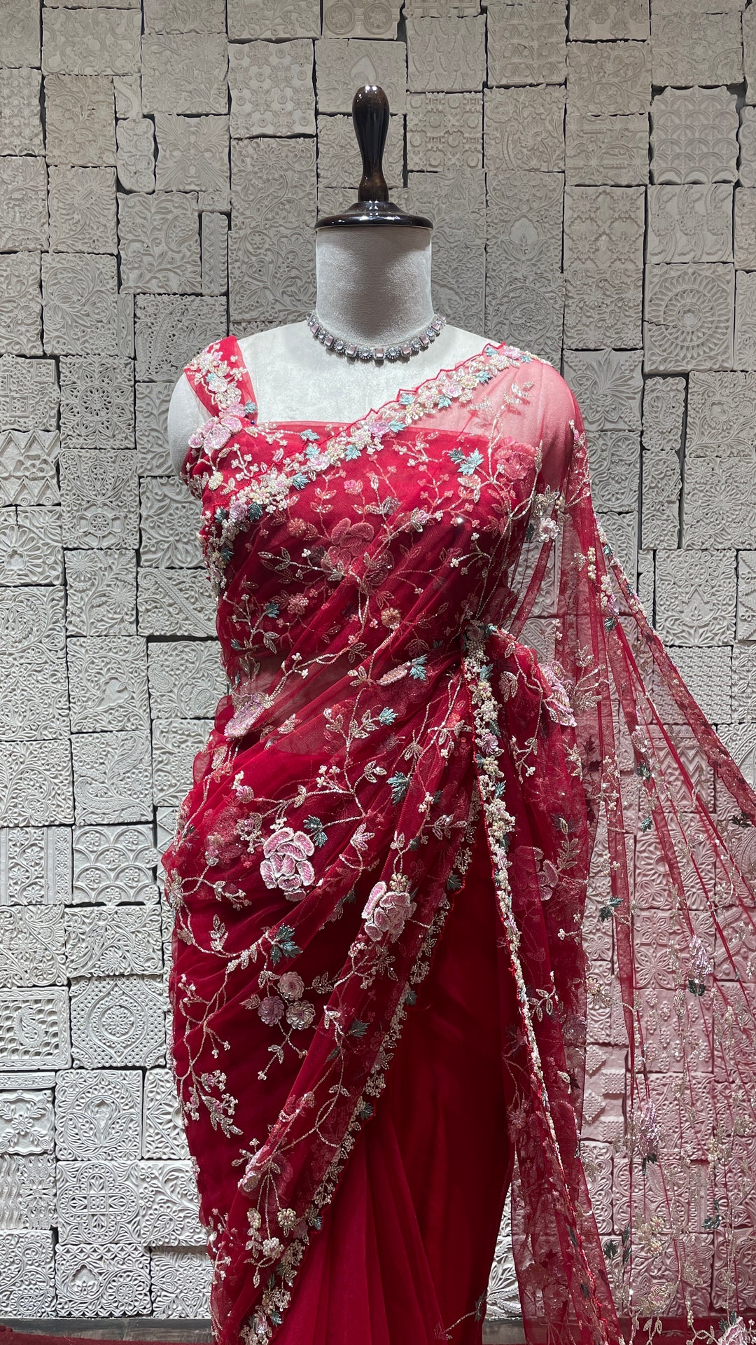 Red net saree with floral motifs