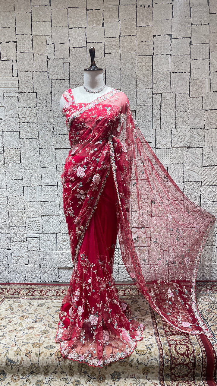 Red net saree with floral motifs