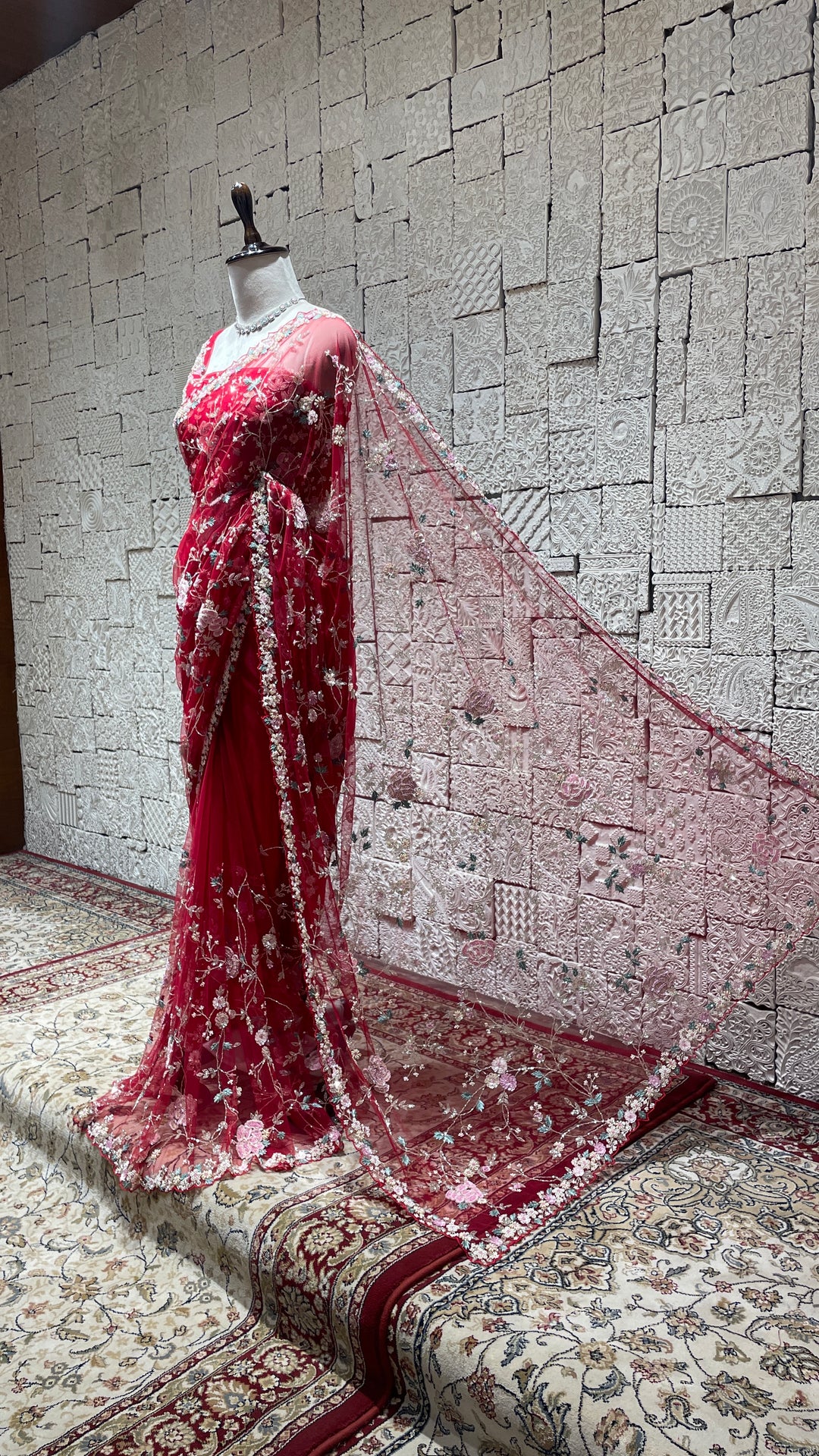 Red net saree with floral motifs