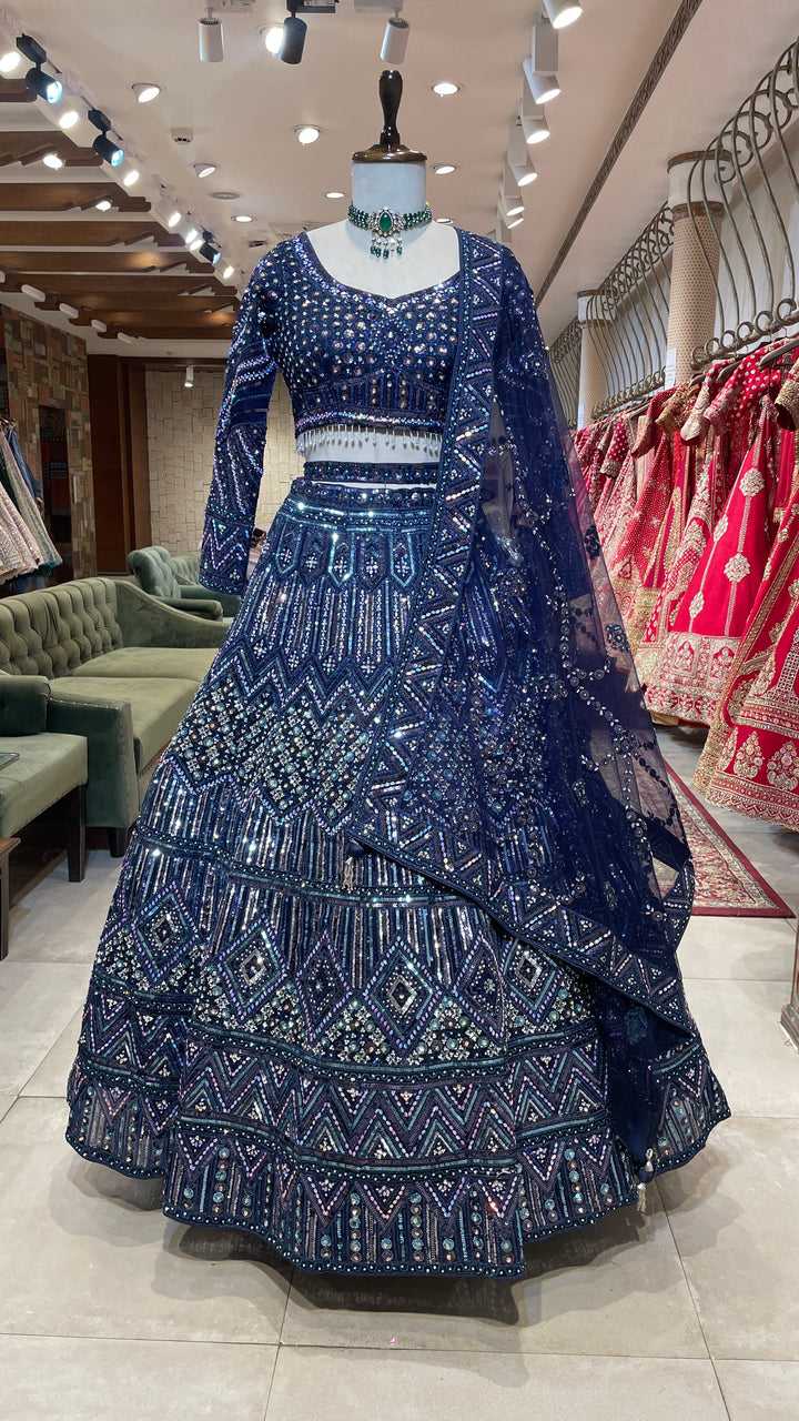 Royal blue net lehenga with sequins and rhinestones