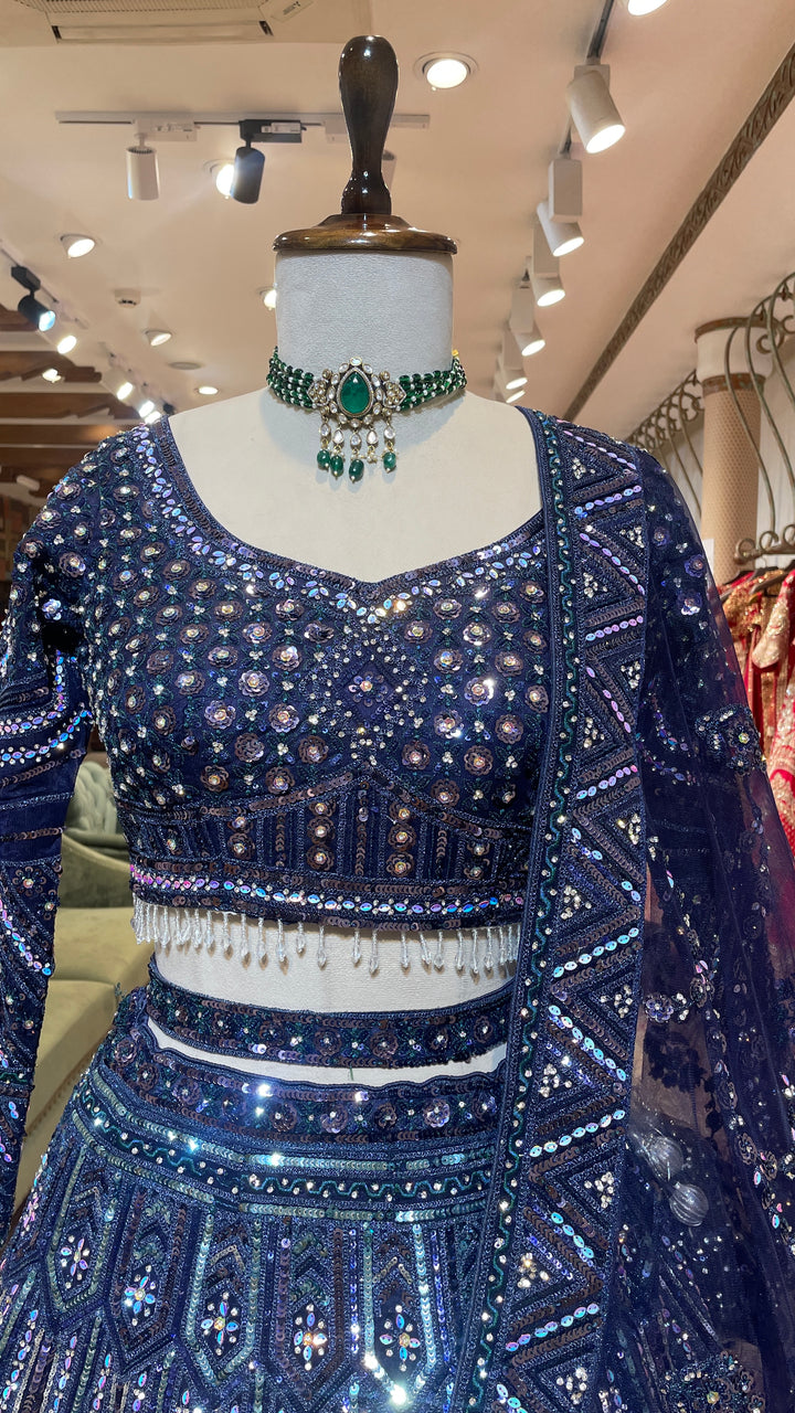 Royal blue net lehenga with sequins and rhinestones