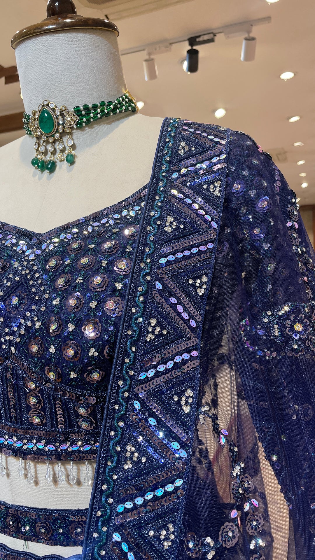 Royal blue net lehenga with sequins and rhinestones