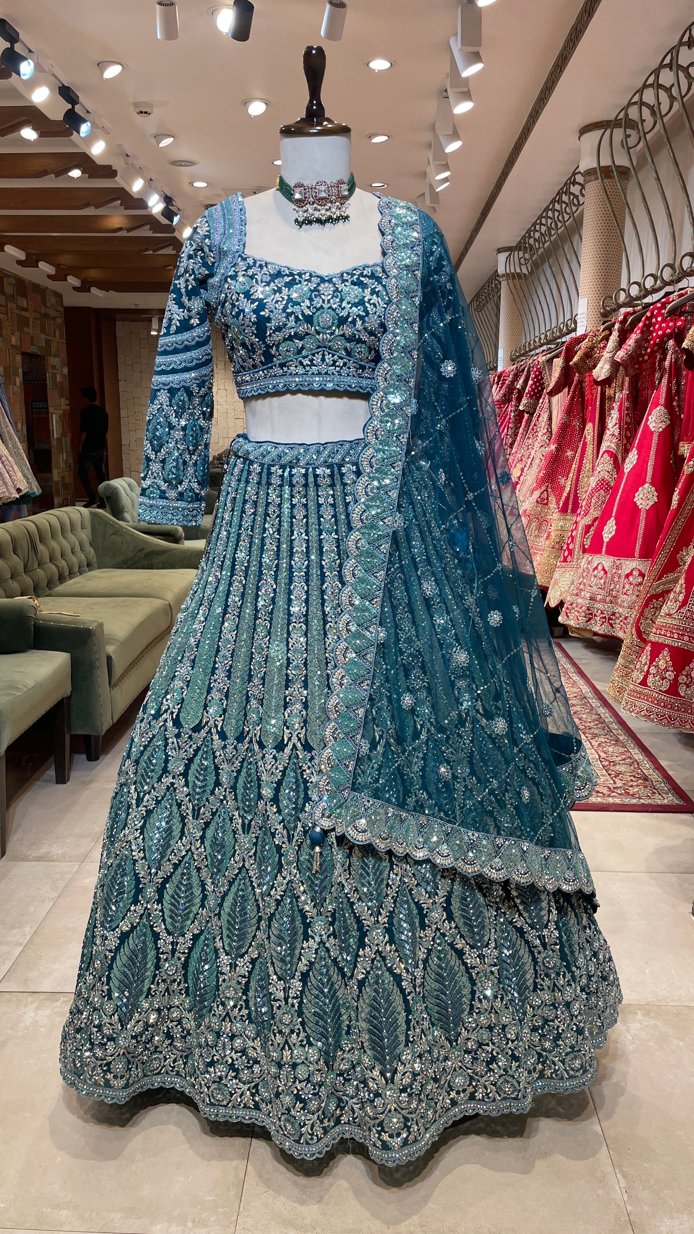 Turquoise blue lehenga with floral motifs