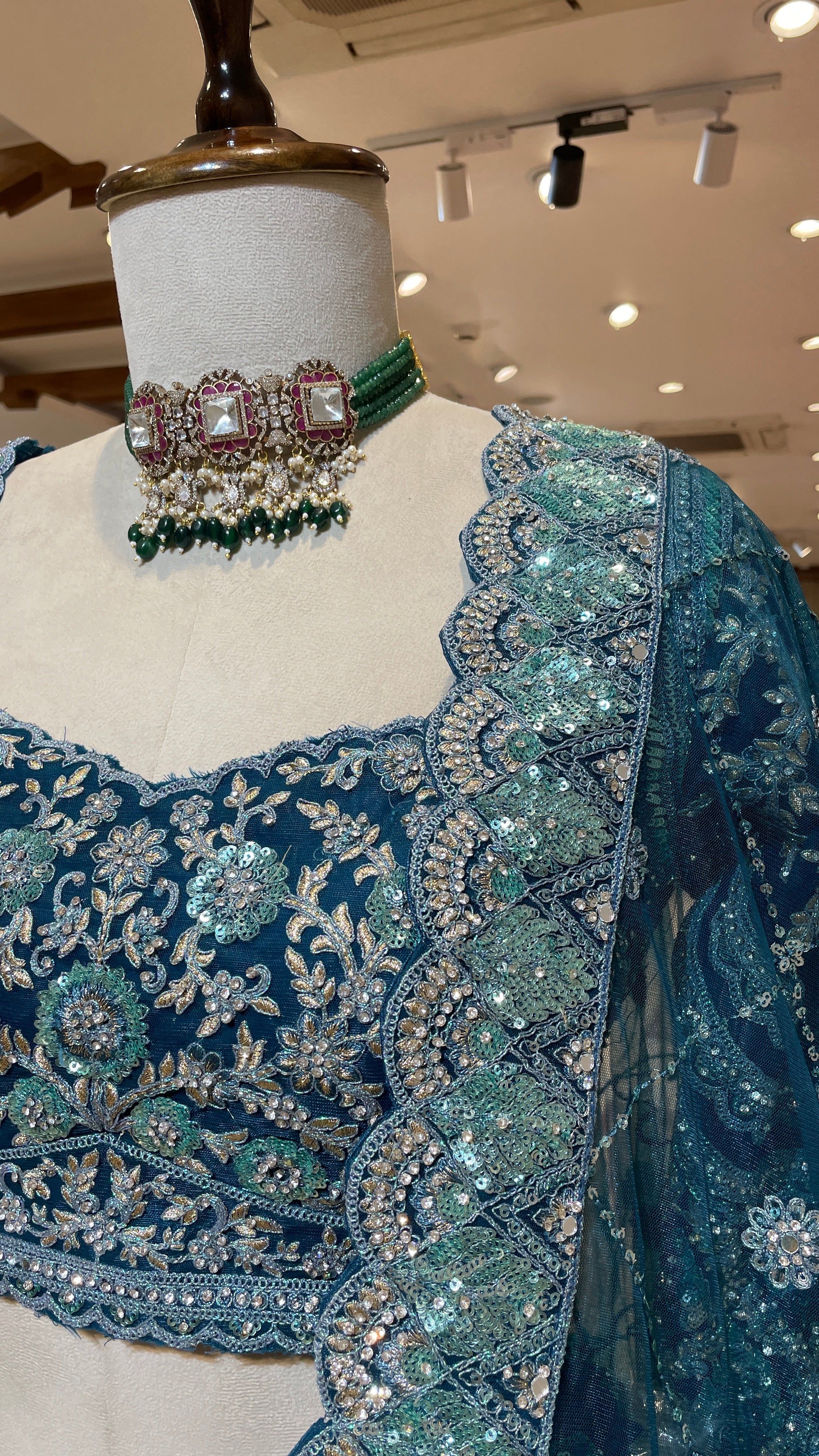 Turquoise blue lehenga with floral motifs