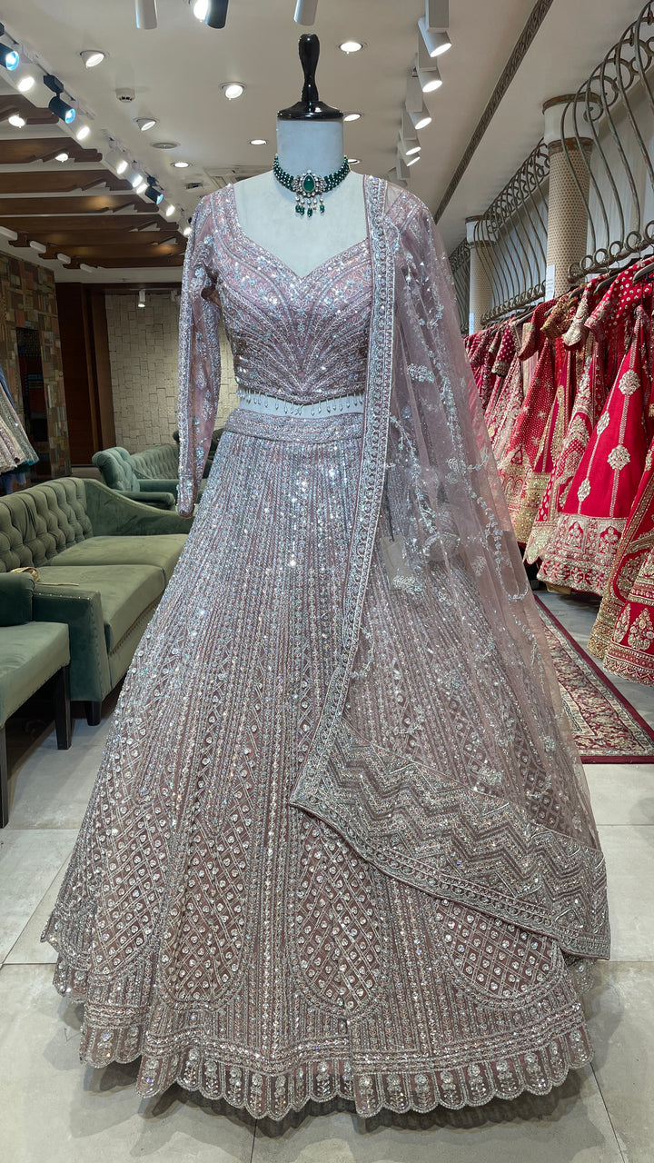 Pastel pink net lehenga with sequins and rhinestones