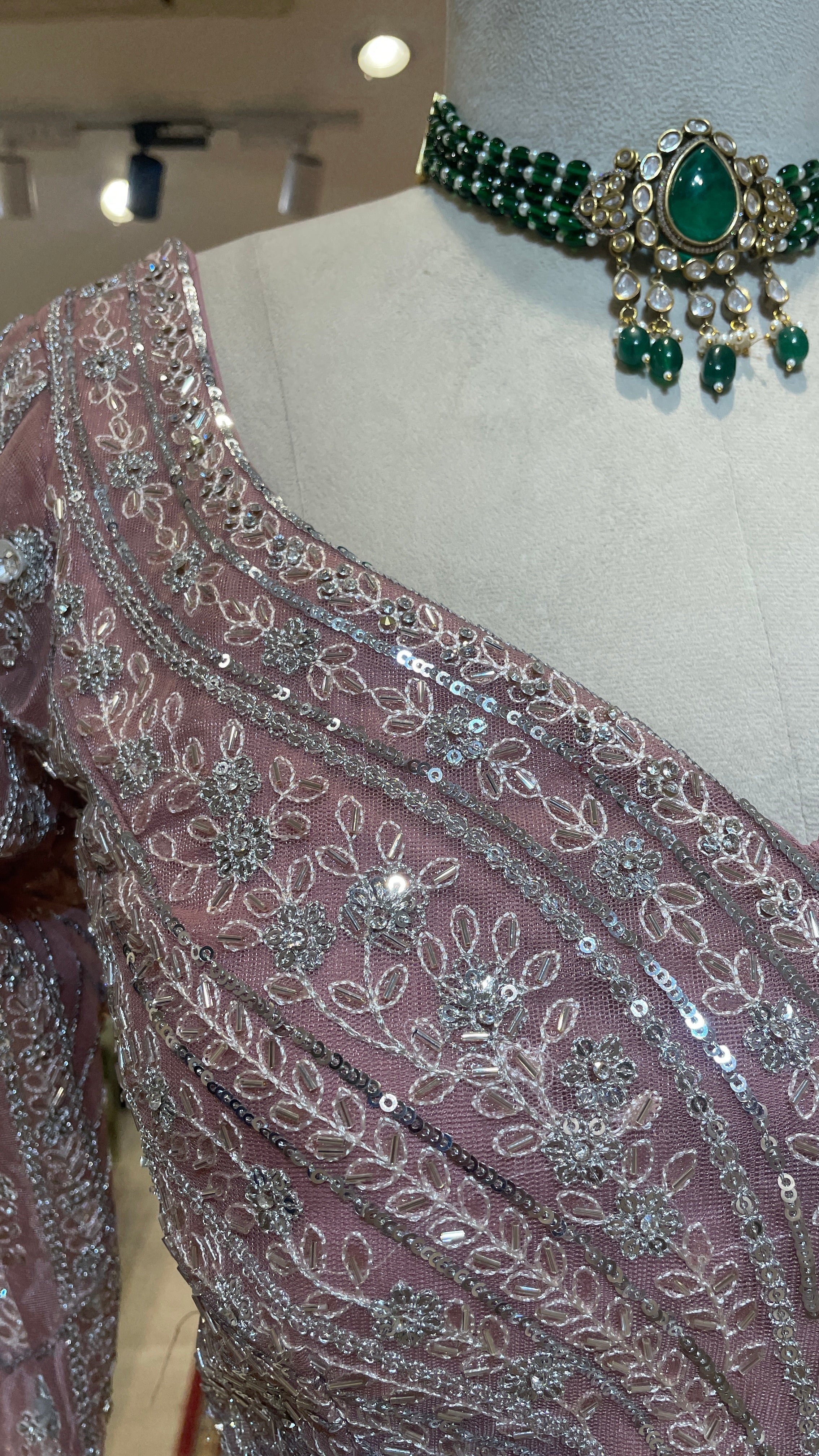 Pastel pink net lehenga with sequins and rhinestones