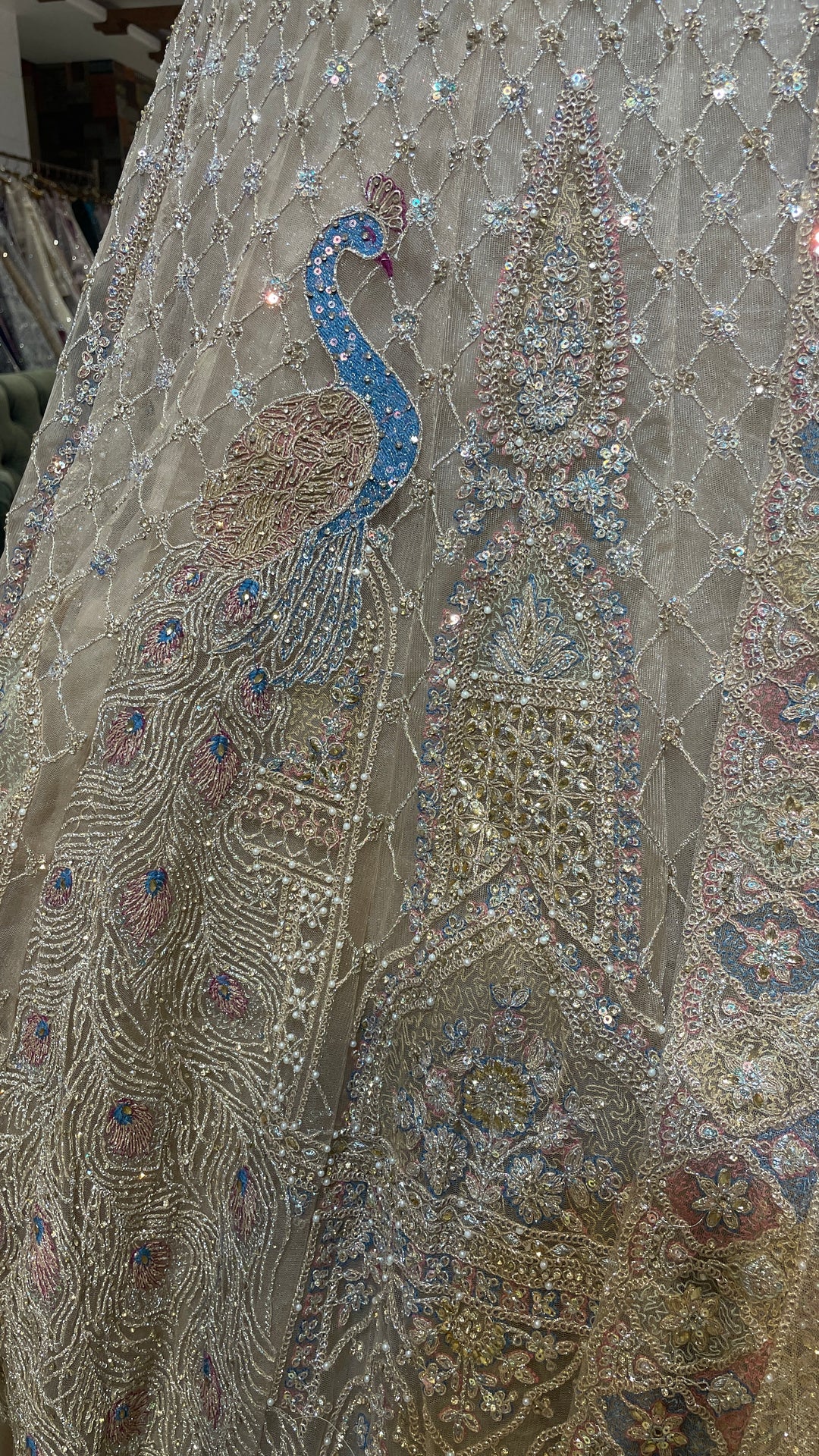 Gold multicolour net lehenga with peacock motifs