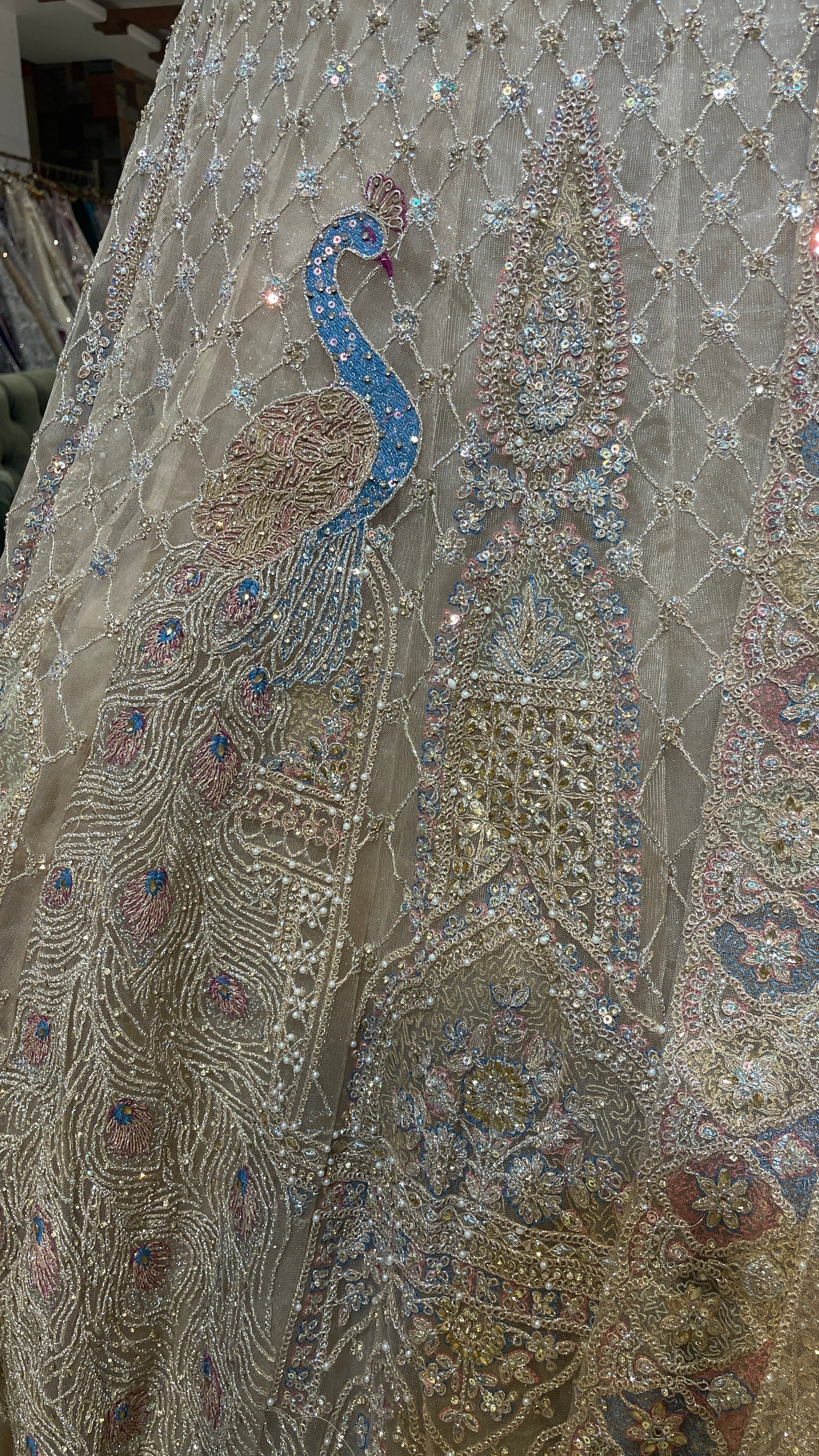 Gold multicolour net lehenga with peacock motifs