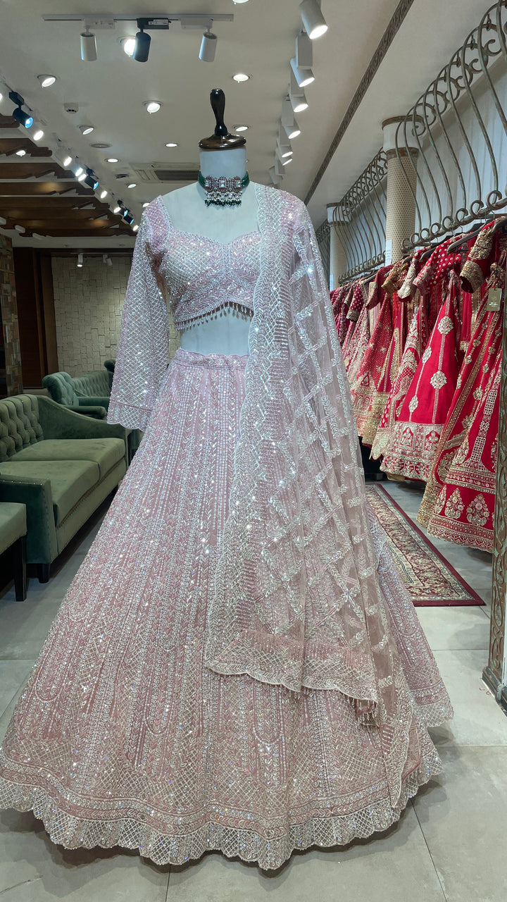 Pastel pink net lehenga with sequins and scallop dupatta