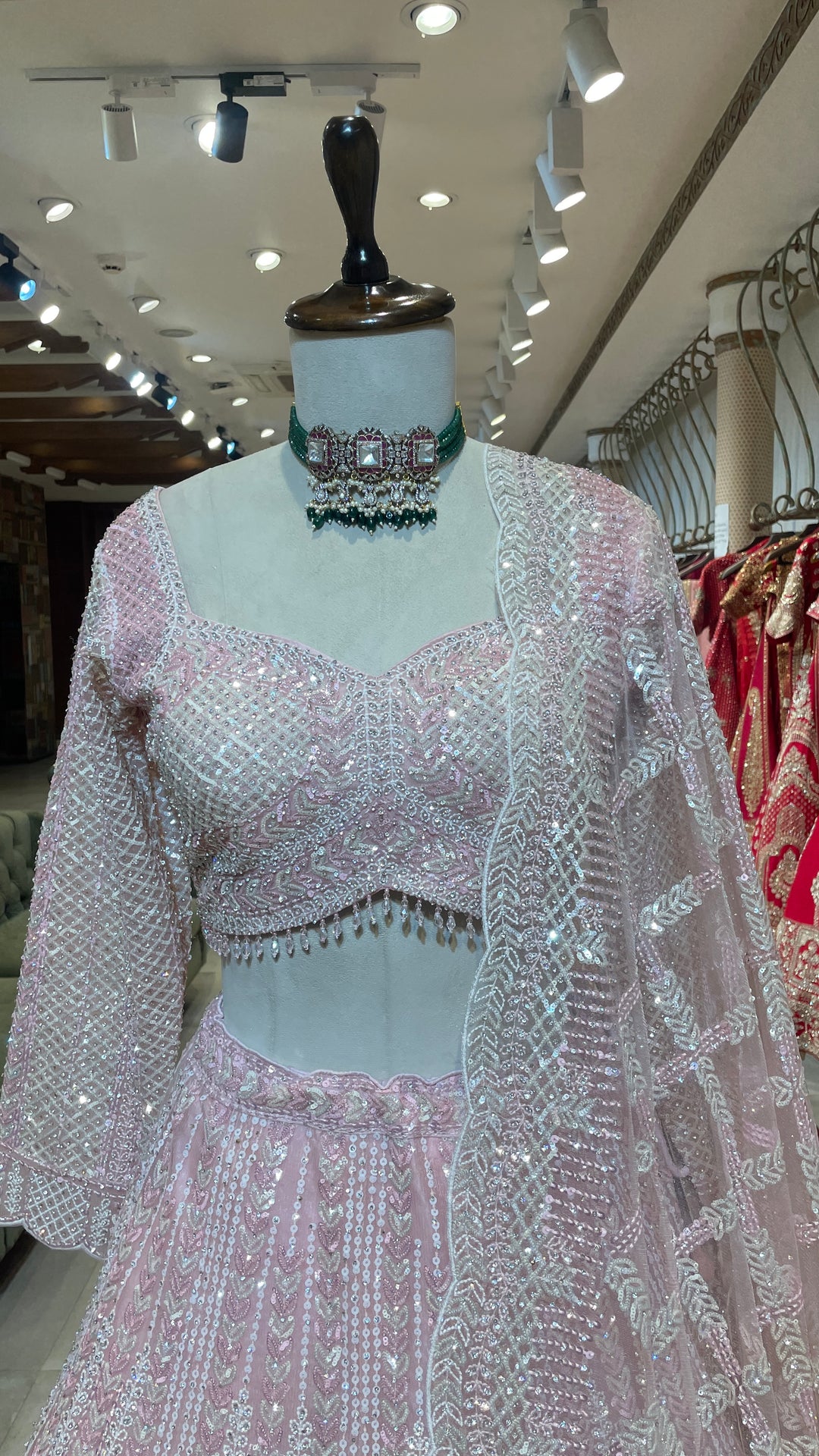 Pastel pink net lehenga with sequins and scallop dupatta