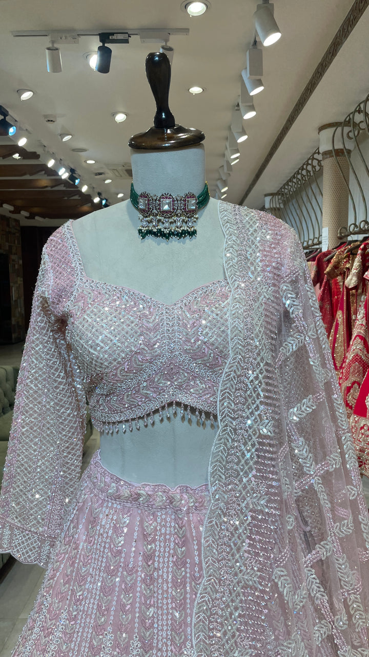 Pastel pink net lehenga with sequins and scallop dupatta