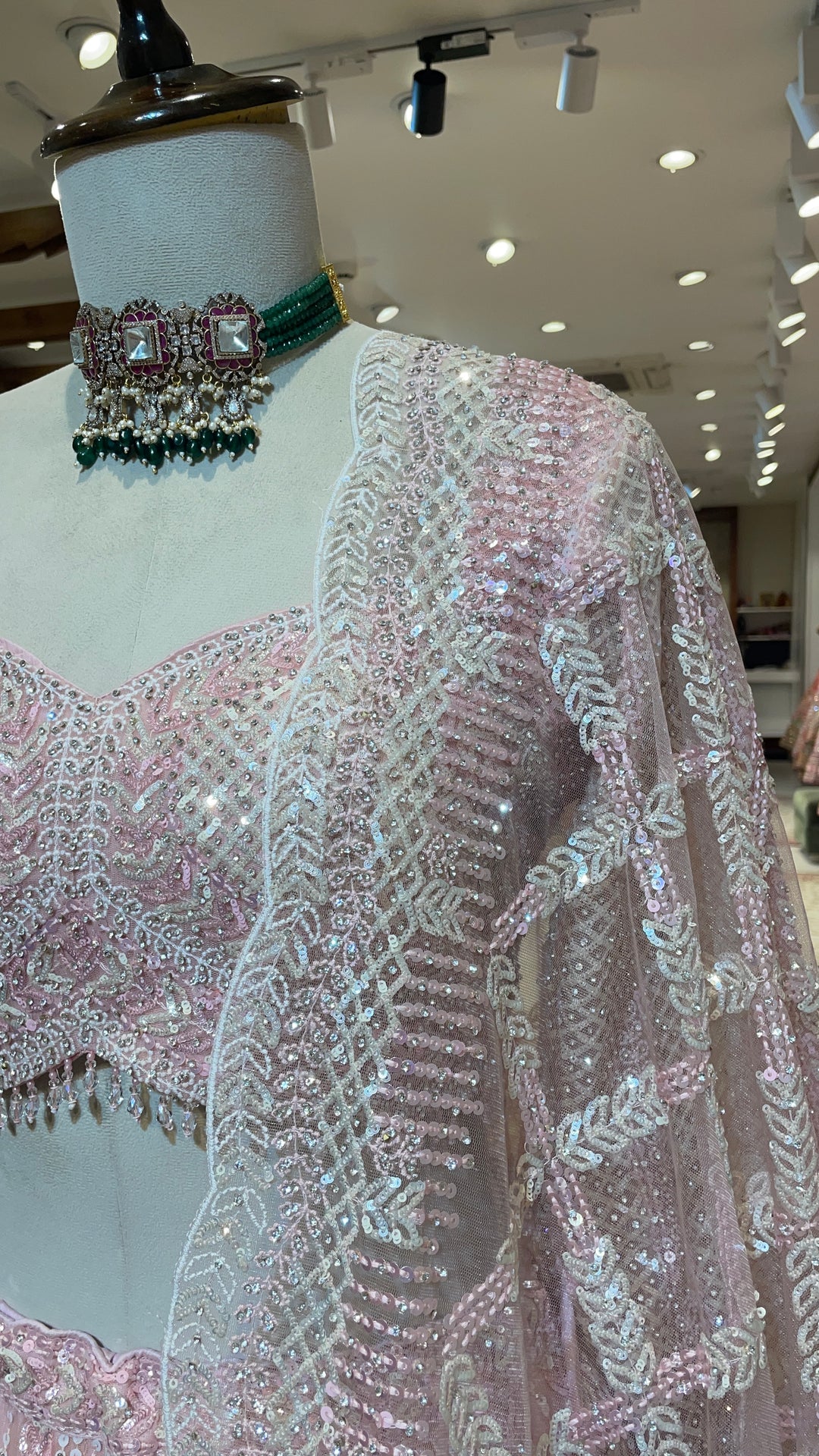 Pastel pink net lehenga with sequins and scallop dupatta