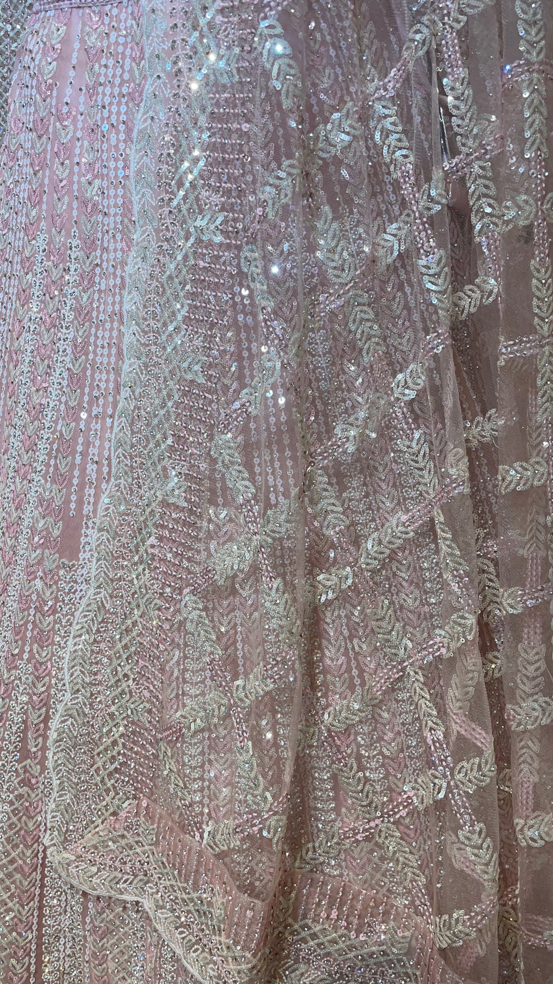 Pastel pink net lehenga with sequins and scallop dupatta