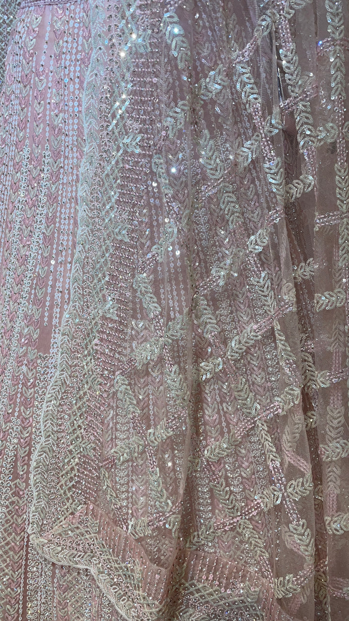 Pastel pink net lehenga with sequins and scallop dupatta