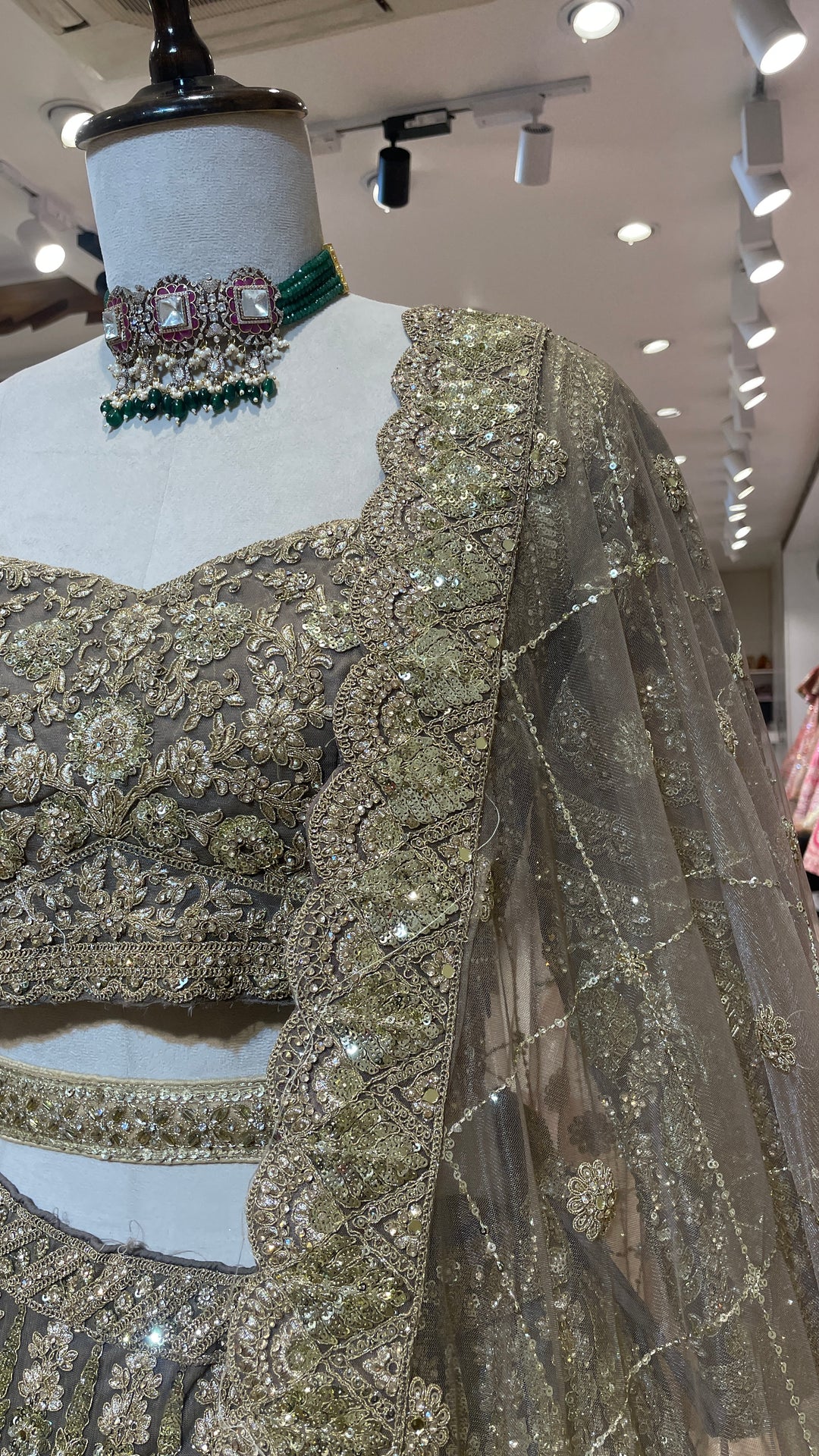 Net lehenga with gold embellishments